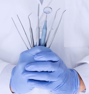 close-up-of-dentist-hands-with-dental-equipment-8ACQEX6-1.jpg